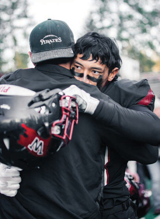 Football players hugging